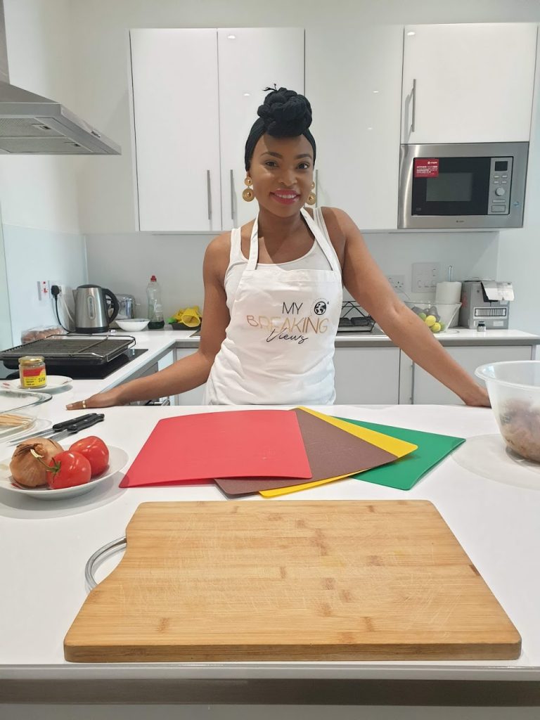 Black British woman making suya