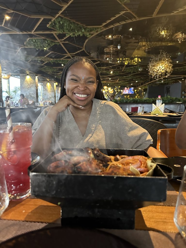 Black British Woman in India eating Indian food 