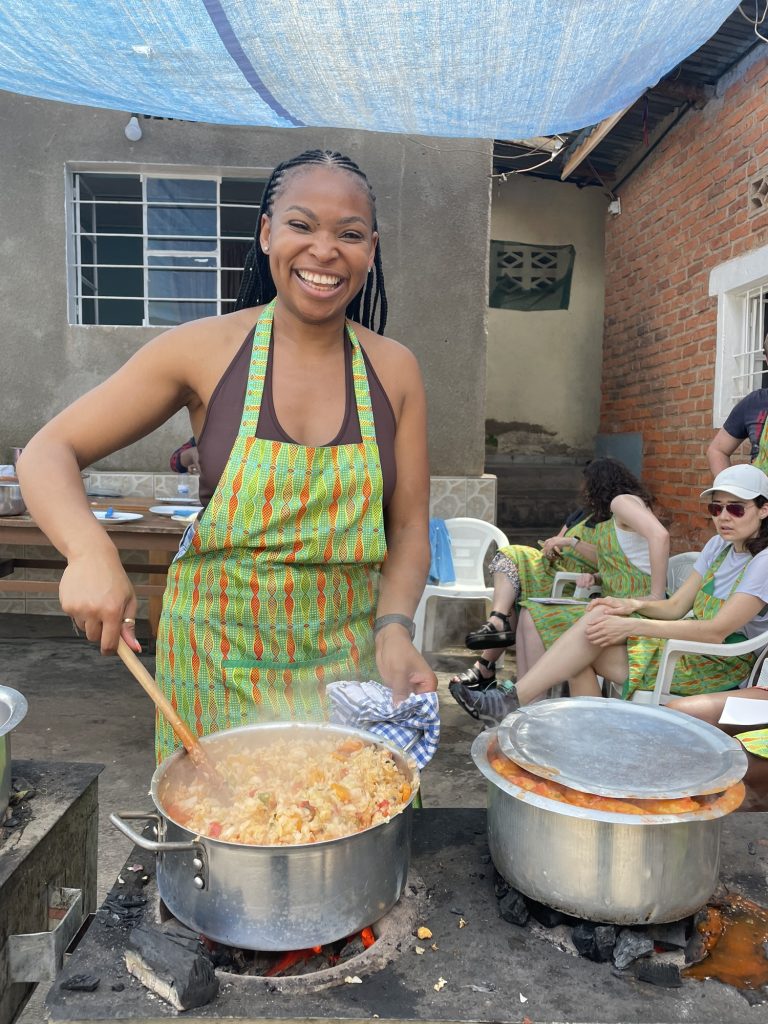 Black British Woman cooking in Rwanda  
