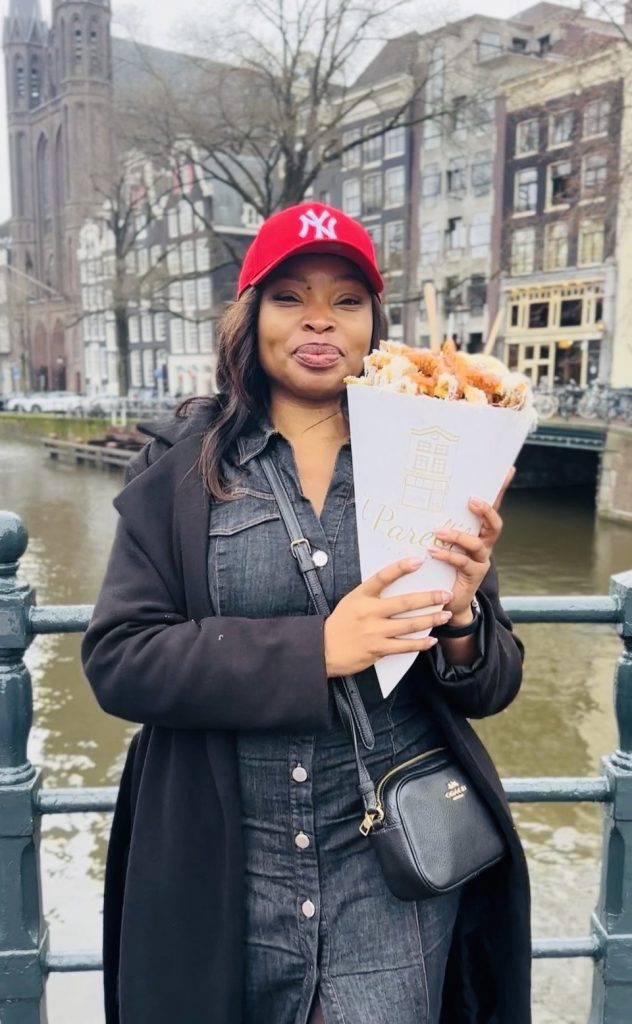 Amsterdam Travel Guide: 3 Amazing Days in Amsterdam Where to Eat, Stay & Do 't Pareltje Black Brith Women eating dutch fries